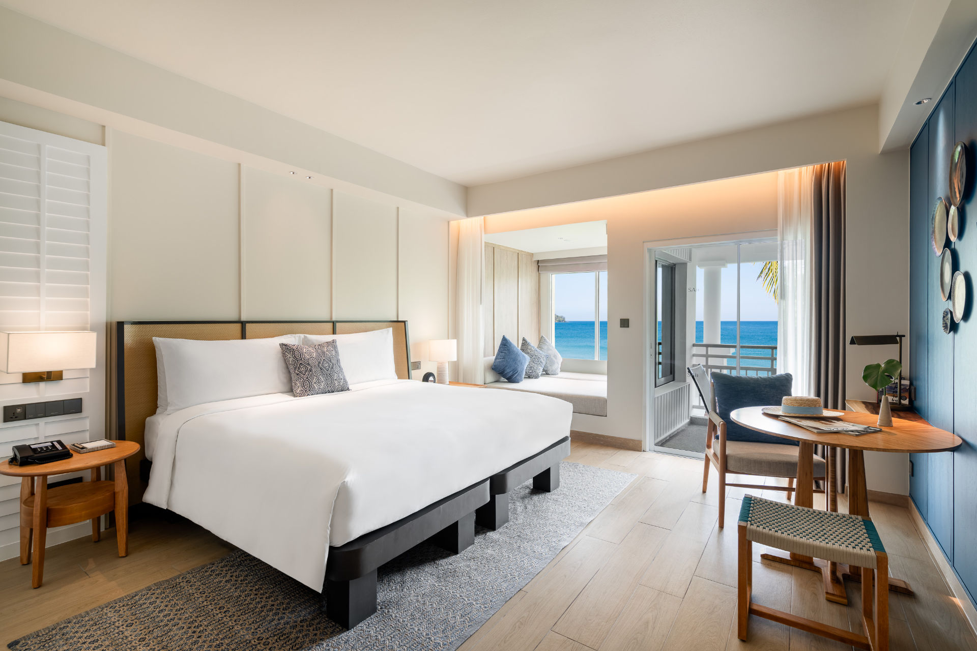 A spacious bedroom with a view of the ocean